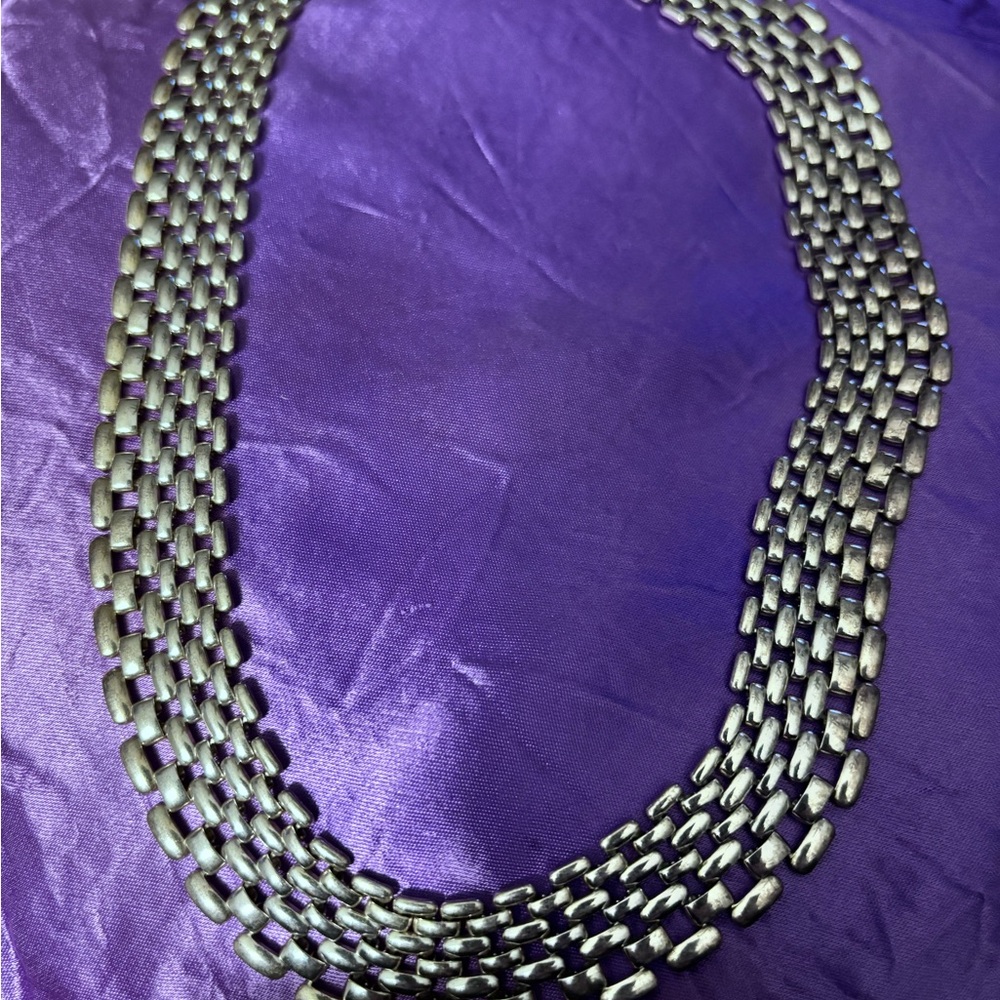 Silver chain-like necklace
